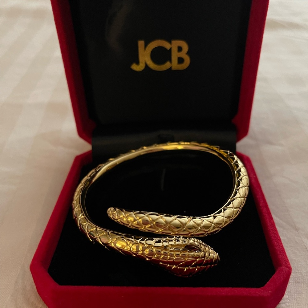 Gold Serpentine Bangle Bracelet with Intricate Detailing